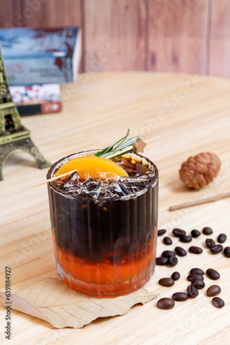 Cold brew peach or black coffee with peach. Fresh iced coffee.