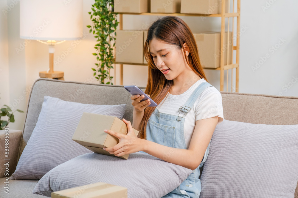 Asian women SME freelance working with packaging startup entrepreneur small business owner at home,Online business seller packaging and delivery concept Asian women SME freelance working with packaging startup entrepreneur small business owner at home,Online business seller packaging and delivery concept