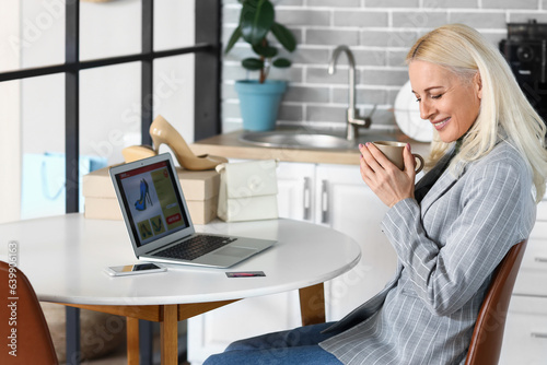 Smiling woman online shoppi...