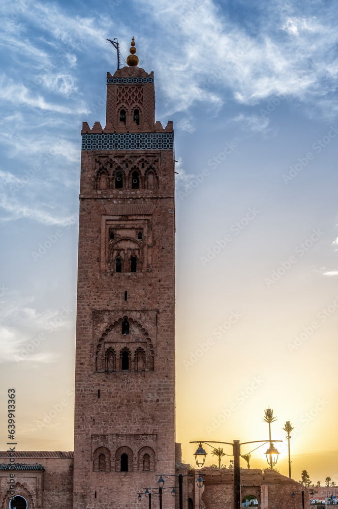 Koutoubia Mosque Tower in Marrakech at sunset, Morocco, blue sky background
