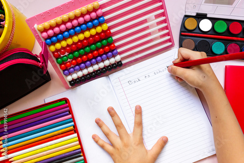 The little girl writes 