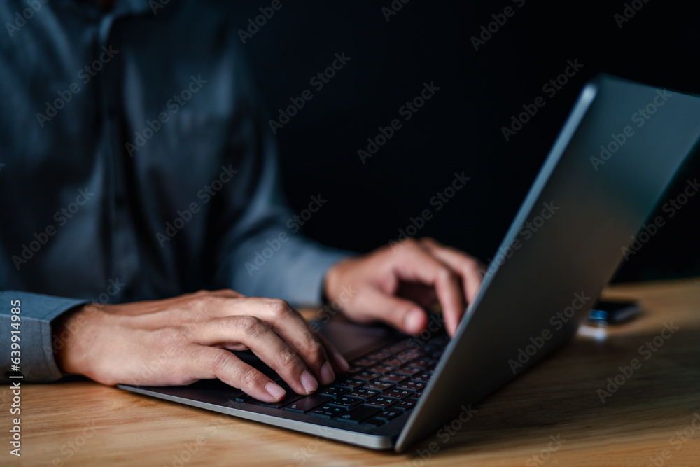 laptop, typing, close up, hand, businessman, portrait, background, blue, keyboard, formal. picture is portrait close up to businessman, him typing at keyboard on laptop in a serious way for something. laptop, typing, close up, hand, businessman, portrait, background, blue, keyboard, formal. picture is portrait close up to businessman, him typing at keyboard on laptop in a serious way for something.