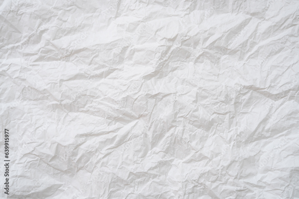 Naklejka premium Wrinkled or crumpled white stencil paper or tissue after use in toilet or restroom with large copy space used for background texture in decorative art work.