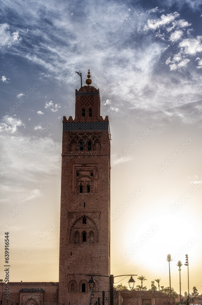 Koutoubia Mosque Tower in Marrakech at sunset, Morocco, blue sky background