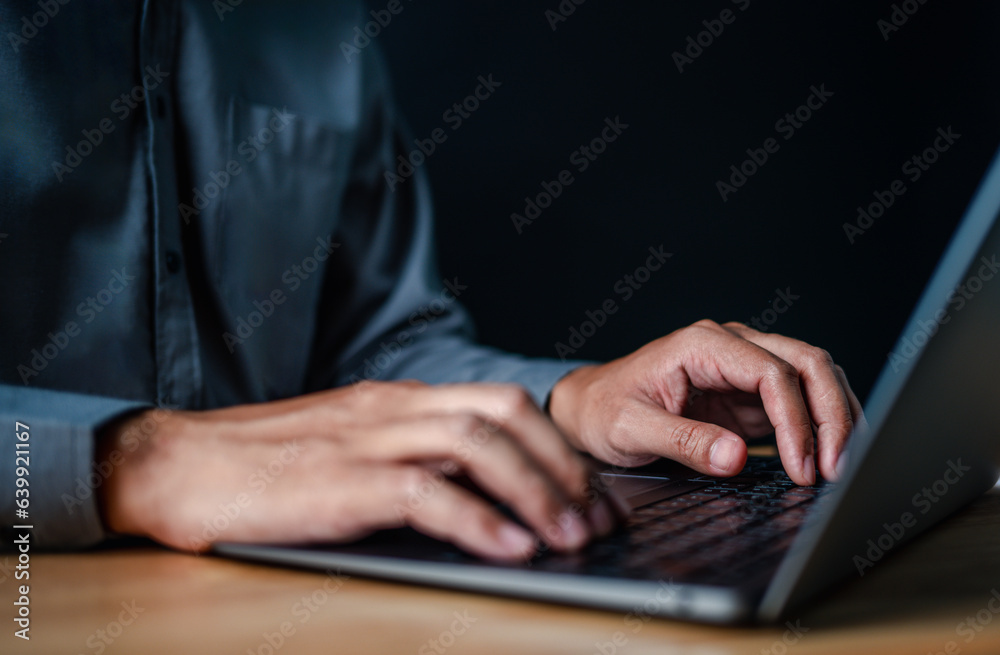 laptop, typing, close up, hand, businessman, portrait, background, blue, keyboard, formal. picture is portrait close up to businessman, him typing at keyboard on laptop in a serious way for something. laptop, typing, close up, hand, businessman, portrait, background, blue, keyboard, formal. picture is portrait close up to businessman, him typing at keyboard on laptop in a serious way for something.