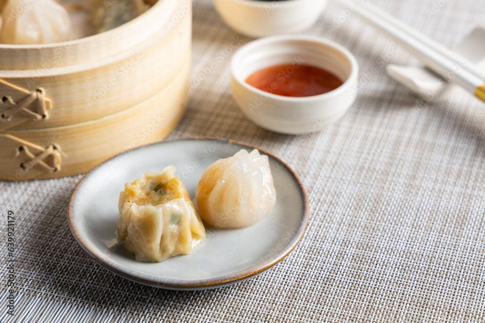 Dim sum steamed in a bamboo basket. Dim sum steamed in a bamboo basket.