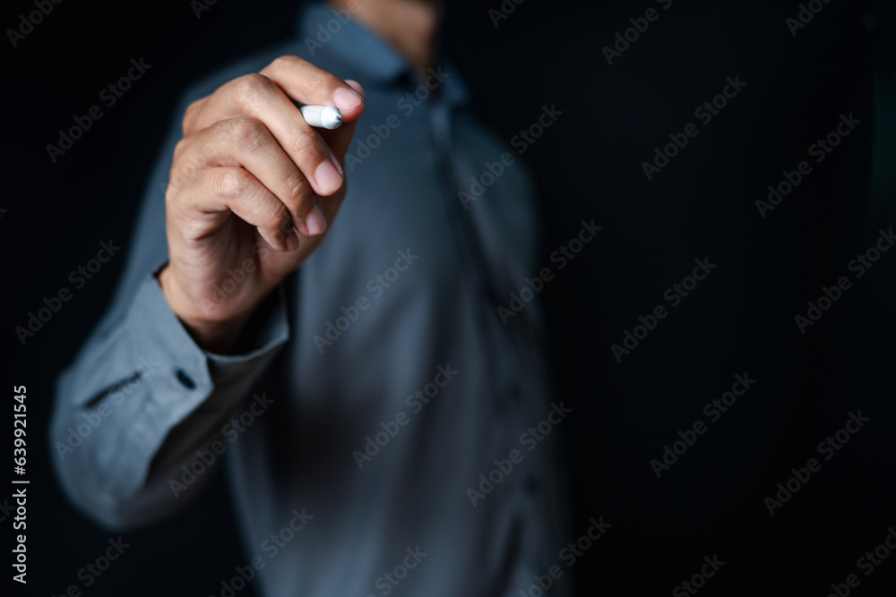 background, close up, people, hand, businessman, portrait, showing, equipment, blue, standing. picture is portrait close up to businessman, him stand and use pen going to write or draw something. background, close up, people, hand, businessman, portrait, showing, equipment, blue, standing. picture is portrait close up to businessman, him stand and use pen going to write or draw something.