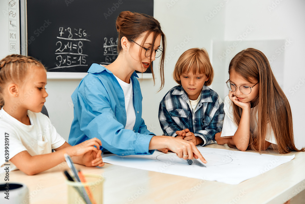Children learning in a school classroom Children learning in a school classroom