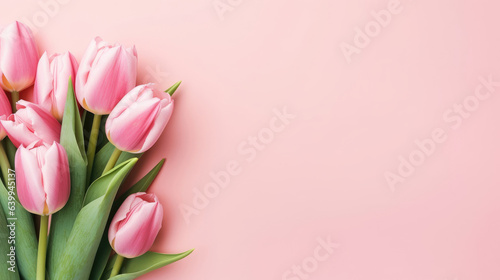 Greeting card of bouquet of pink tulips on a pastel pink background with copy space