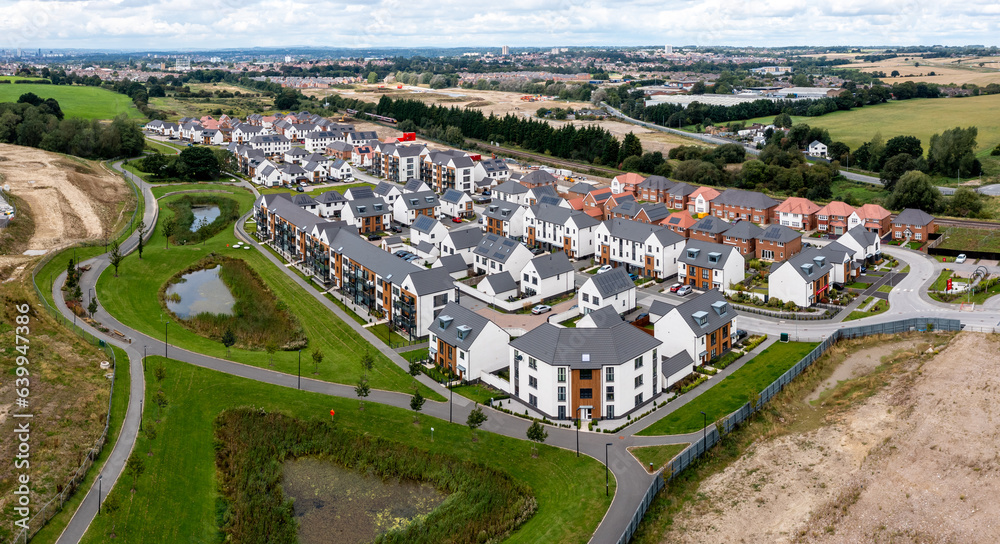 A modern housing development on the outskirts of a big city with new build houses