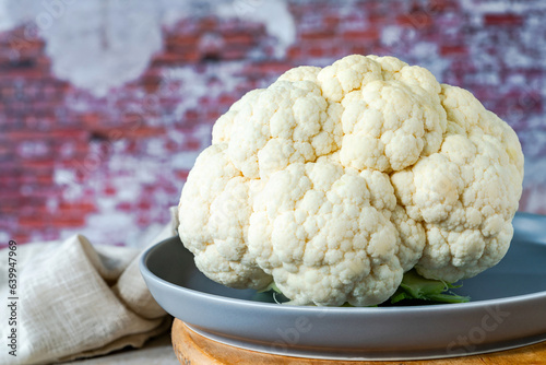 Whole cauliflower head on a plate