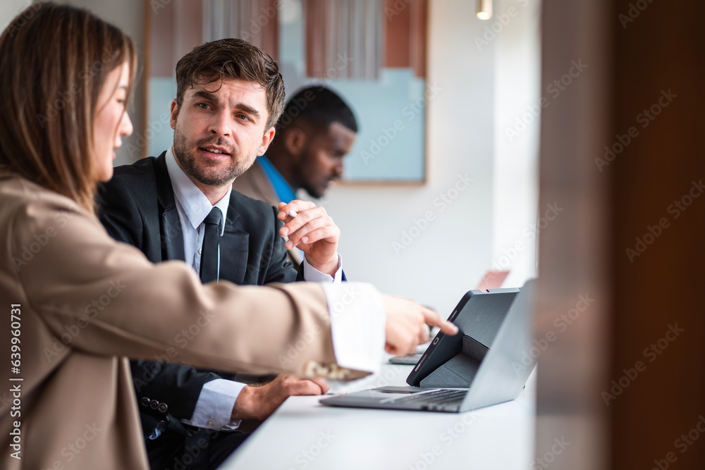 Fototapeta premium Male mature caucasian ceo businessman leader with diverse coworkers team executive managers group meeting. Multicultural professional businesspeople working together on research plan boardroom.