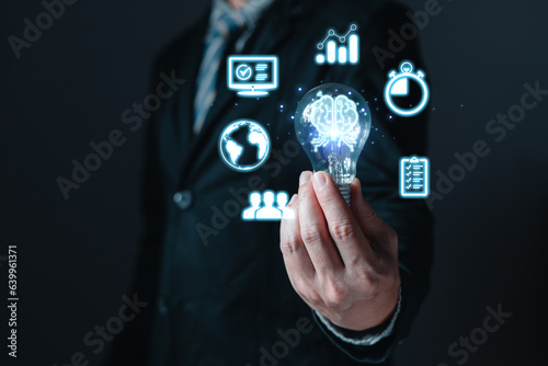 innovation technology success business. Digital transformation. Ai technology. person hand holding a power lightbulb and pretending to think, inspiration, creativity, and imagination concept.