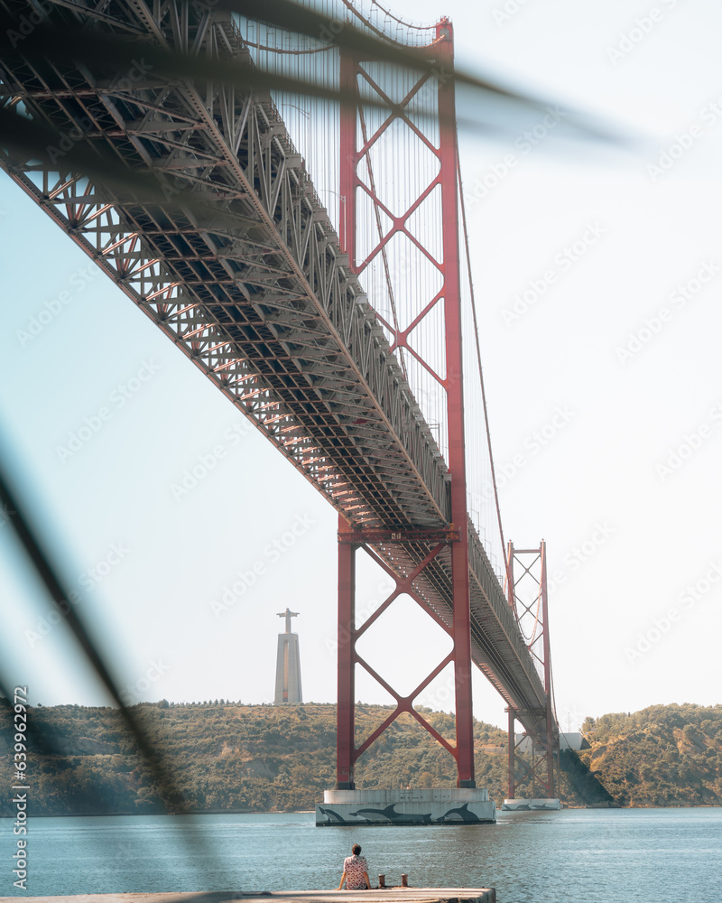 man looking at 25 ponte, Lisbon, portugal