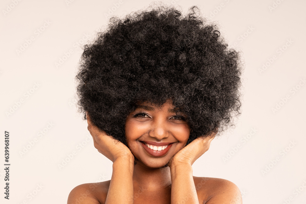 Beauty Portrait of Female Model with Afro Hairstyle. Smiling African Woman with Natural Look and Delicate Makeup. Beauty Portrait of Female Model with Afro Hairstyle. Smiling African Woman with Natural Look and Delicate Makeup.