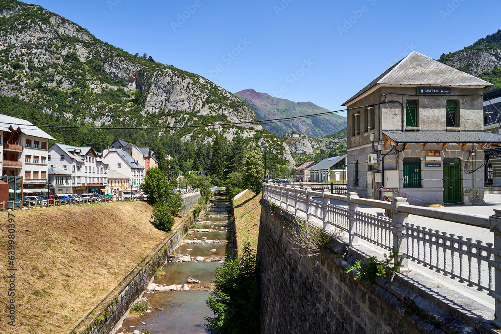 Old station of canfranc with the Aragon river passing next to it.