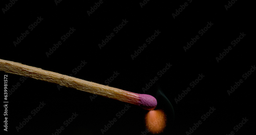 Igniting Match against Black background Igniting Match against Black background