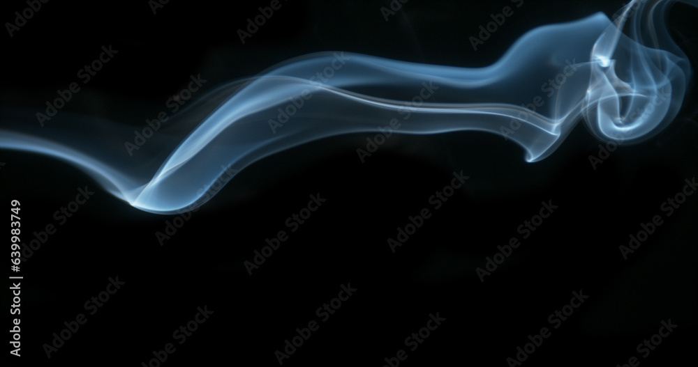 Smoke of Cigarette rising against Black Background Smoke of Cigarette rising against Black Background