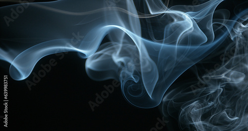 Smoke of Cigarette rising against Black Background