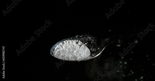 Drug, Cocaine in spoon against black background