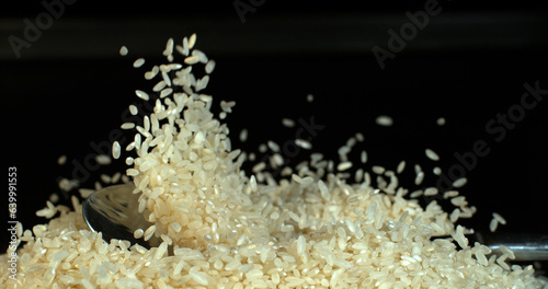 Rice falling against Black Background
