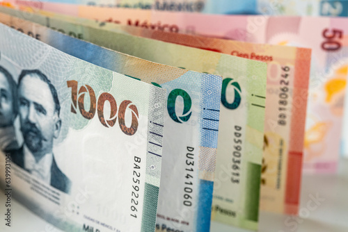 Bild auf Leinwand Mexico money, mexican pesos, stacked various banknotes, 1000 pesos banknote, fin
