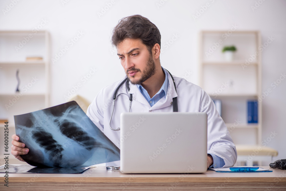 Young male doctor radiologist working in the clinic Young male doctor radiologist working in the clinic