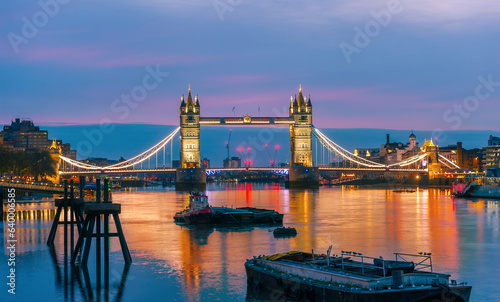 Panorama of the famous River Thames and the historical Tower Bridge illuminated at night in London Town  United Kingdom
