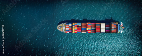 Industrial import-export port prepare to load containers. Aerial top view container ship in export and import global business and logistic. Global transportation and logistic business.