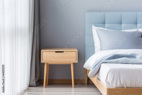 Bedroom interior with a stylish nightstand next to bed. Minimalist and elegant design. 