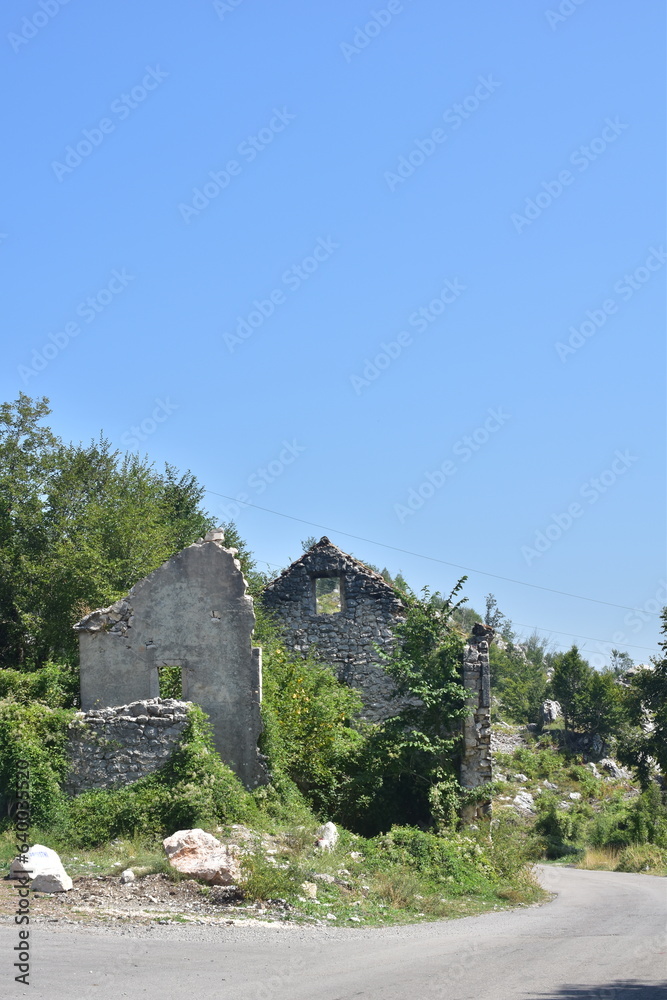 Old abandoned stone house on the countryside. 