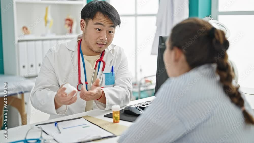 Man and woman doctor and patient prescribe pills treatment at clinic Man and woman doctor and patient prescribe pills treatment at clinic