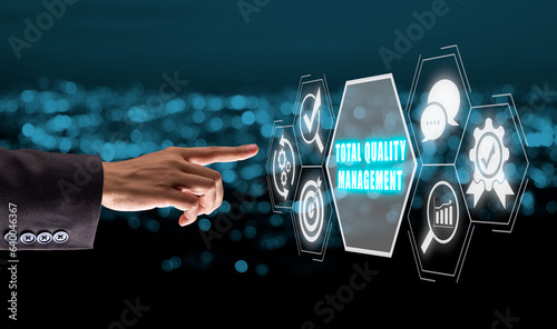 Quadro su tela Total quality management concept, Business person hand touching total quality management icon on virtual screen