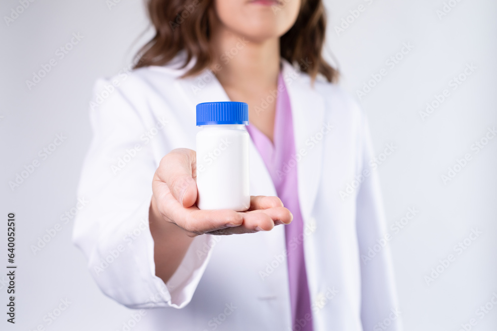 medication mock up bottle on the pharmacist or doctor's hand. medication mock up bottle on the pharmacist or doctor's hand.