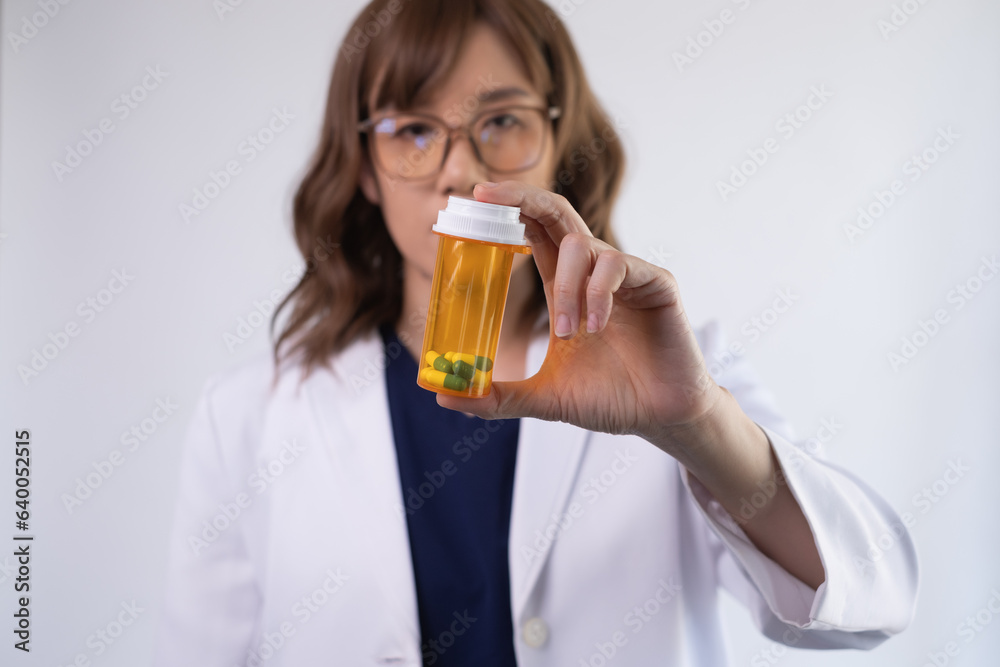 The doctor or pharmacist holding capsule medication. The doctor or pharmacist holding capsule medication.