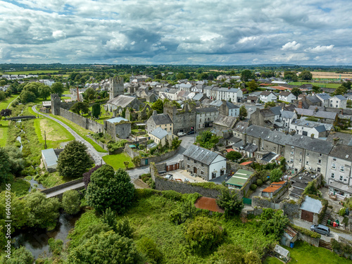 Aerial view of Fethard old medieval walled town in County Tipperary on the Clashawley River with Gothic Church and mural tower house photo