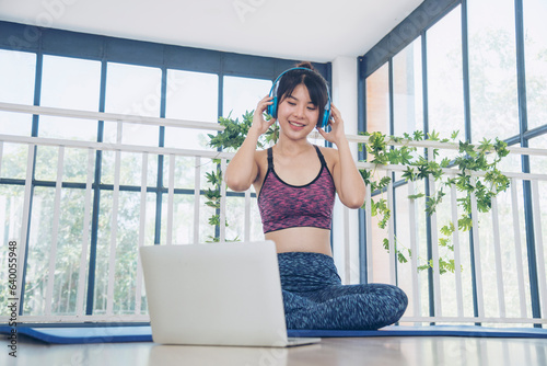 Beautiful woman smile listen music. Yoga woman workout in sportswear sit on yoga mat home fitness workout exercise. Happy beauty women dance on floor use headphone listen to music wellness lifestyle Free Download Beautiful woman smile listen music. Yoga woman workout in sportswear sit on yoga mat home fitness workout exercise. Happy beauty women dance on floor use headphone listen to music wellness lifestyle - GFXLoad