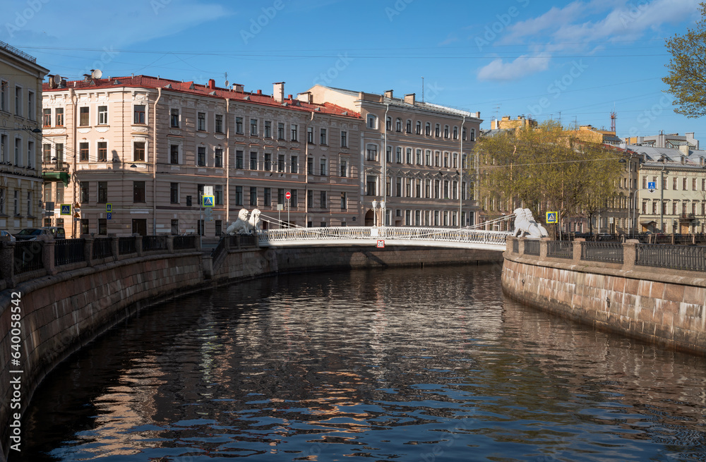 View of the Lion Bridge across the Griboyedov Canal on a sunny summer day, St. Petersburg, Russia
