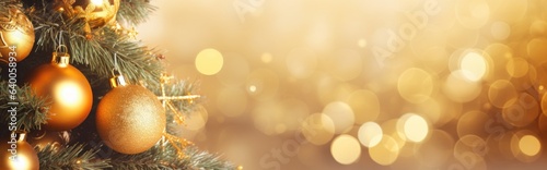 Golden sparkle Christmas lights around a Christmas tree with gold baubles. Wide format banner. Background with atmosphere of celebration and magic.