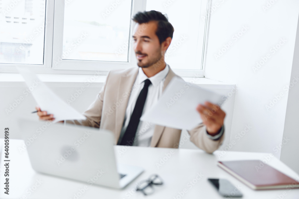 Holding planning paper looking document expertise laptop happy company businessman adult suit office Holding planning paper looking document expertise laptop happy company businessman adult suit office