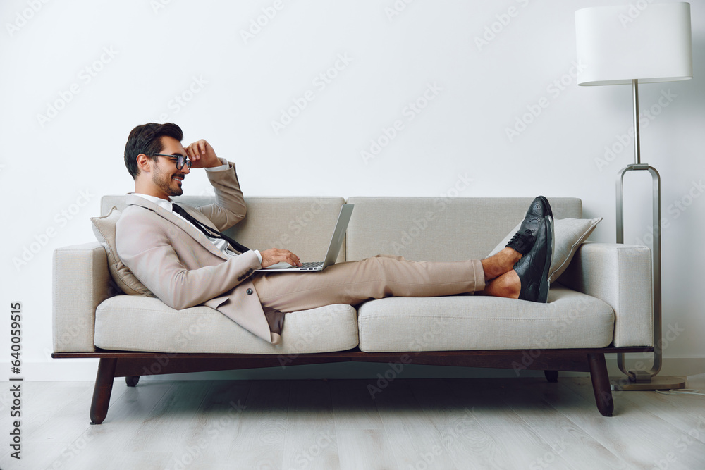 Man couch sofa business laptop home call video Man couch sofa business laptop home call video