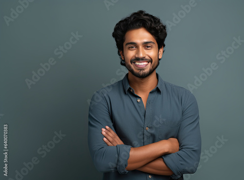 Indian man with crossed arms wearing a formal shirt