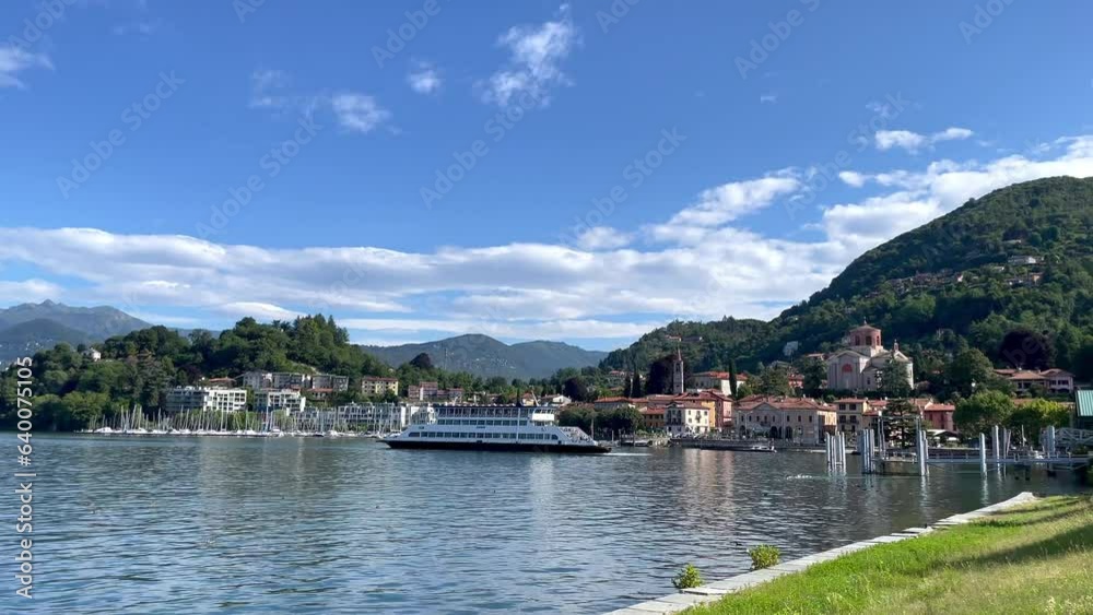 Video, ferry from Intra enters the port of Laveno, summer, sun on Lake Maggiore, blue sky, clouds, Alps, mountain panorama, Lombardy, Italy, Europe Video, ferry from Intra enters the port of Laveno, summer, sun on Lake Maggiore, blue sky, clouds, Alps, mountain panorama, Lombardy, Italy, Europe