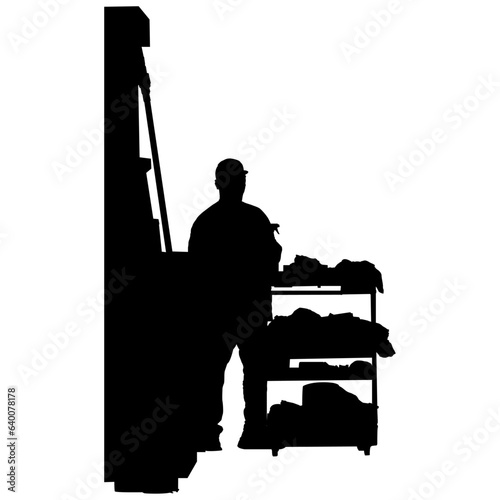 silhouette of a gas station worker