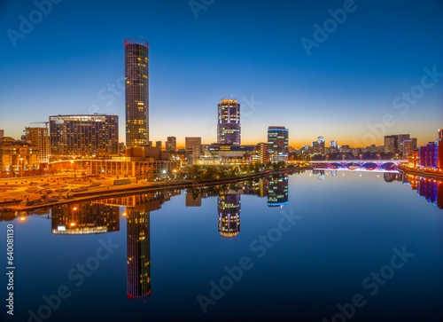 Yekaterinburg city and pond aerial panoramic view at summer or early autumn night. Night city in the early autumn or summer. © Dmitrii Potashkin