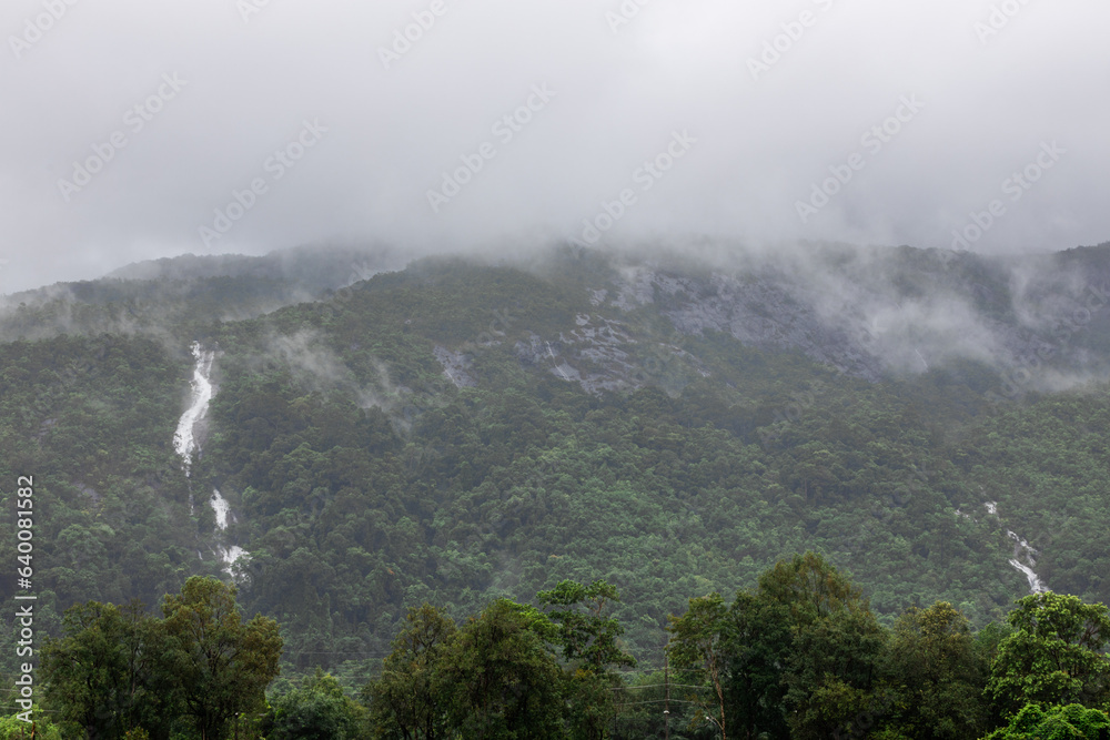 The abstract blurry background of the nature of water droplets from scattered waterfalls covering grass and stone surfaces, the beauty of spontaneous ecosystems. The abstract blurry background of the nature of water droplets from scattered waterfalls covering grass and stone surfaces, the beauty of spontaneous ecosystems.