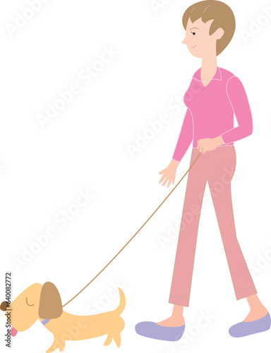 犬を連れて散歩をする女性
