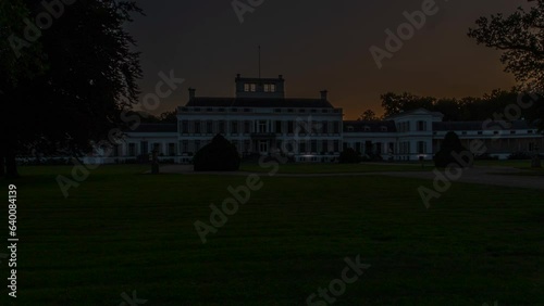 Time lapse of the sun rising behind a beautiful white palace in the Netherlands - slow zoom out photo