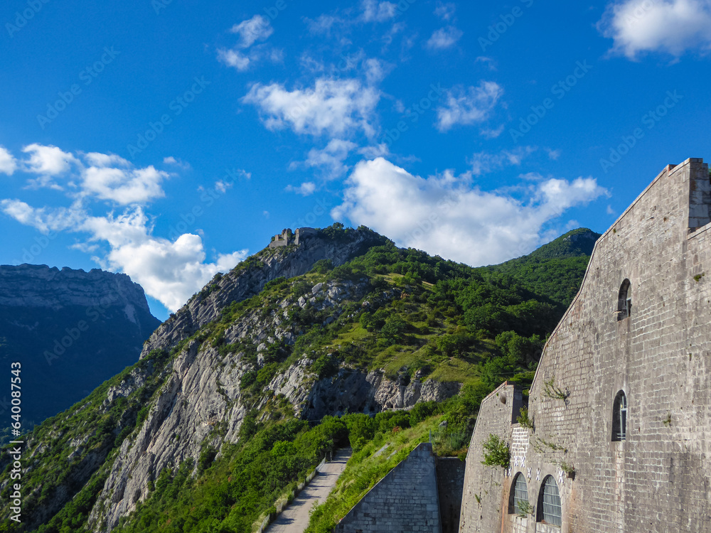 Scenic view of ruins on a hill near the Bastille Fortress. 19th century military fortress overlooking the city of Grenoble, Auvergne-Rhone-Alps, France, Europe. Mountain Troops Memorial on Mont Jalla