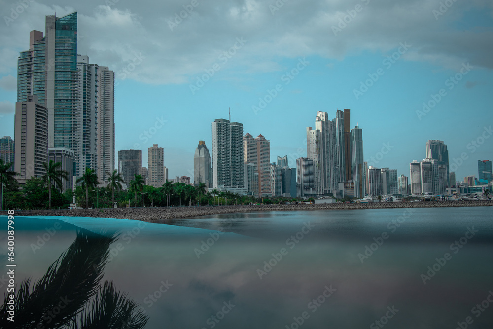 Cityscape of Panama downtown with visible high skyscrapers and business houses, looking from across the bay.